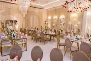 a banquet hall with tables and chairs and chandeliers at Radisson Blu Hotel, Durban Umhlanga in Durban +71 photos