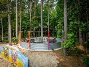 a playground in the middle of the woods at Hermann Grain Bins BNB Entire Complex sleeps 16 in Hermann