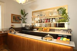 a bar in a restaurant with a counter at Hotel Il Sole in Empoli