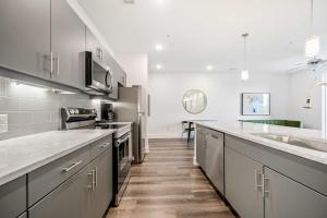 a kitchen with a sink and a counter top at 2B2B with Private Balcony Modern & Stylish - 2B4 in Atlanta