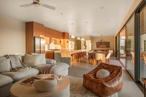 a living room with a couch and a table at Pool - Spa - Fire pit - Views - BBQ - Bella Nova in Joshua Tree