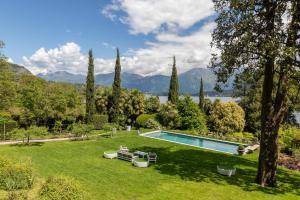 an estate with a swimming pool in a yard at Villa Artemisia by MyVillaCollection in Lenno