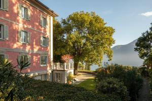 a house with a view of the mountains at Villa Artemisia by MyVillaCollection in Lenno