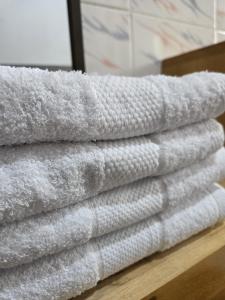 a stack of towels sitting on a table at SEED-Aeroport Nsimalen Yaounde in Nsimalen