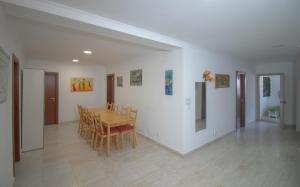 a dining room with a table and chairs at Casa do Luiz in Lisbon