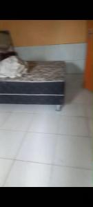 a blurry picture of a dog laying on a bed at Casa em Bezerros in Bezerros