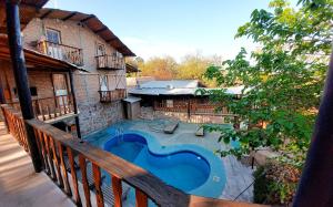 an outdoor swimming pool on a balcony of a house at Hostel Base La Rioja in La Rioja