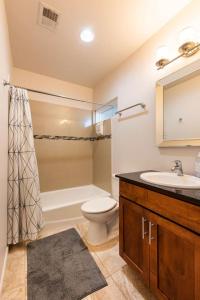 a bathroom with a toilet and a sink and a shower at Studio nr Town Lake and E6th w Balcony by Austin Vacay in Austin +11 photos