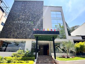 a building with a sign that reads greenway hotel at Greenview Medellin By St Hoteles in Medellín