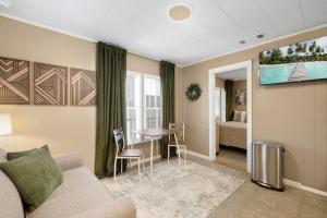 a living room with a couch and a table at A Cedar Key Dock Holiday! in Cedar Key