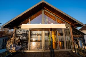 a house with sliding glass doors on a deck at Danube Retreat in Belgrade