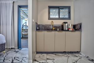 a kitchen with a sink and a window at Yourest HaAri - יורסט הארי in Safed +16 photos