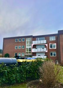 a brick building with a yellow boat in front of it at Bright & Spacious 1BR Apartment in Bielefeld