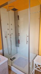 a shower with a glass door in a bathroom at Le Nichoir de la Biesme in Aiseau +28 photos