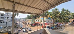 an overhead view of a city street with a building at Ayodhya Home stay in Māvalli