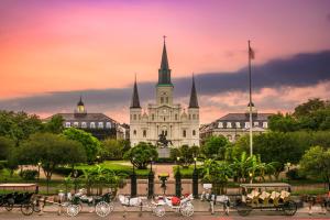 a group of horse drawn carriages in front of a castle at Hotel Indigo New Orleans - French Quarter by IHG in New Orleans