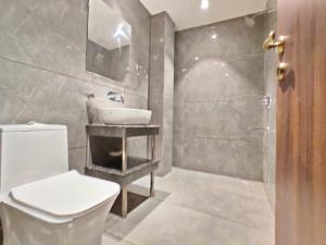 a bathroom with a toilet and a sink and a shower at Hotel Absolut Comfort 500 MTR FROM GOLDEN TEMPLE in Amritsar