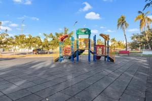 a playground in a park with a clock on it at CASA CON ALBERCA Rodeada de NATURALEZA in Naranjo
