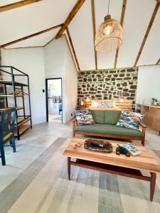 a living room with a couch and a table at Mizpah Lodge in Bloemfontein