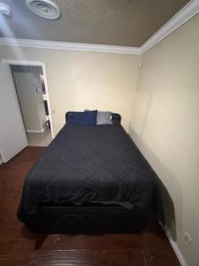 a small bedroom with a bed in the corner at Oldfield in Lancaster