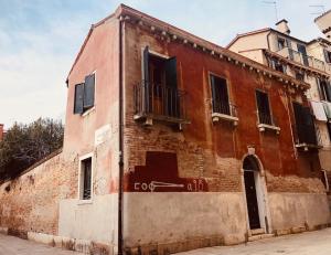 an old brick building on the side of a street at Cà Fede in Venice +7 photos