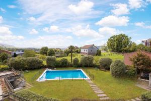 an aerial view of a yard with a swimming pool at El Rincon de las Americas in Colombres