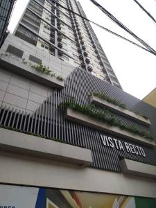 a tall building with plants on the side of it at Orwell Heights-Vista Recto in Manila