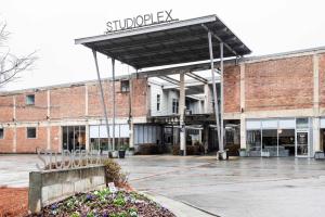 an empty parking lot in front of a brick building at Beltline Shrine in Atlanta