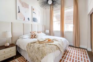 a bedroom with a bed with a tray of food on it at Beltline Shrine in Atlanta