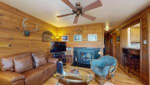 a living room with a couch and a fireplace at Bluff Condo 4015 in Sun Valley
