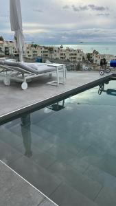 a plane sitting on top of a pool of water at Luxurious villa with ocean views in Callao Salvaje