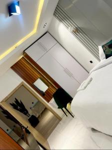 an overhead view of a bedroom with a bed and a desk at Greyfield Apartment 1 in Benin City