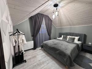 a bedroom with a bed and a window in it at Brick House in Slavske