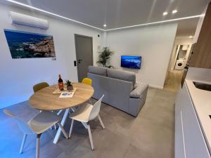 a living room with a table and a couch at La Cala de Alcalá Luxury in Alcalá