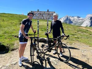 a man and a woman standing next to a bike at Gîte Maison Planté a1 - Hautes Pyrénées in Argelès-Gazost