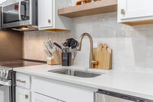 a kitchen with a sink and a counter top at Park Hotel Studio Suite 307 in Chattanooga