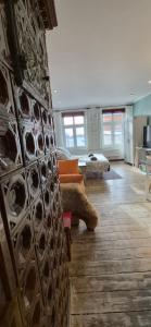 a living room with a couch and a living room with at Staszica Starówka in Olsztyn