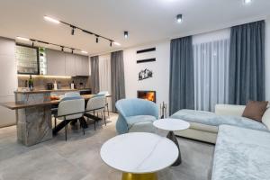 a living room with a couch and a table at Golden peak Blidinje in Blidinje