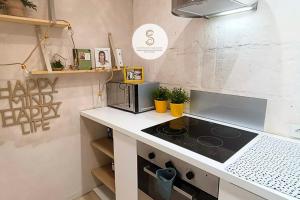 a kitchen with a stove and a counter top at Coté Nature Arles Centre in Arles +8 photos