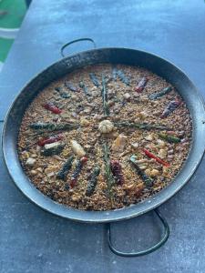 a cake in a pan on a table at Basi Resort in Nombre de Dios