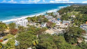 an aerial view of the beach and buildings at Charming Studio by Sandy Beach - Affordable & Private in Rincon
