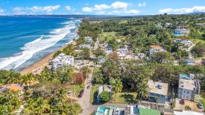an aerial view of a beach with condos at Charming Studio by Sandy Beach - Affordable & Private in Rincon