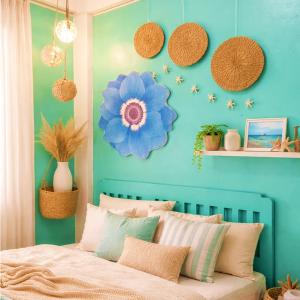 a bedroom with a blue wall with a bed at Crieta Costello Homestay in San Juan +8 photos