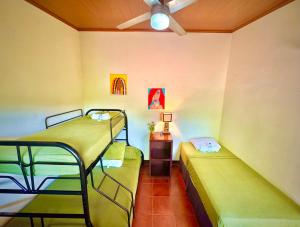 two bunk beds in a room with a ceiling at Casa Lula León Hostal in León
