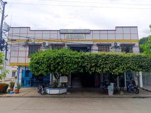 a building with trees in front of it at Hotel Gallineral in San Martín
