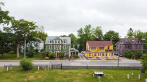 a group of houses in a town with a street at Garrison House Inn in Annapolis Royal +15 photos