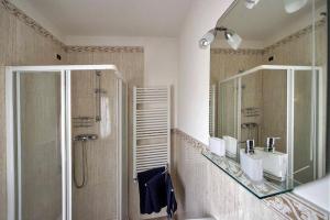 a bathroom with a shower and a sink and a mirror at Cà Fede in Venice