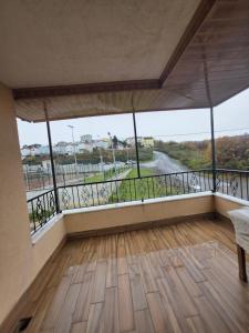 a room with a balcony with a view of a road at Eşsız Manzara in Atakum +14 photos