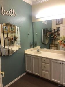 a bathroom with a sink and a mirror at The Cozy Coast Nest in Oceano +7 photos
