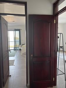 an open door in a room with a living room at Villa Aurora Samaná in Santa Bárbara de Samaná +96 photos
